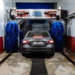 A car being washed with automatic equipment