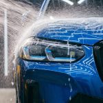 A car being washed in a modern car wash