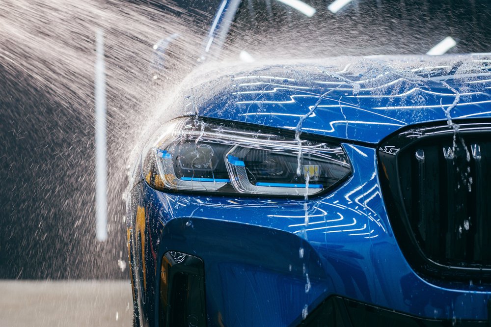 A car being washed in a modern car wash