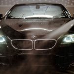 automatic carwash showering a vehicle clean