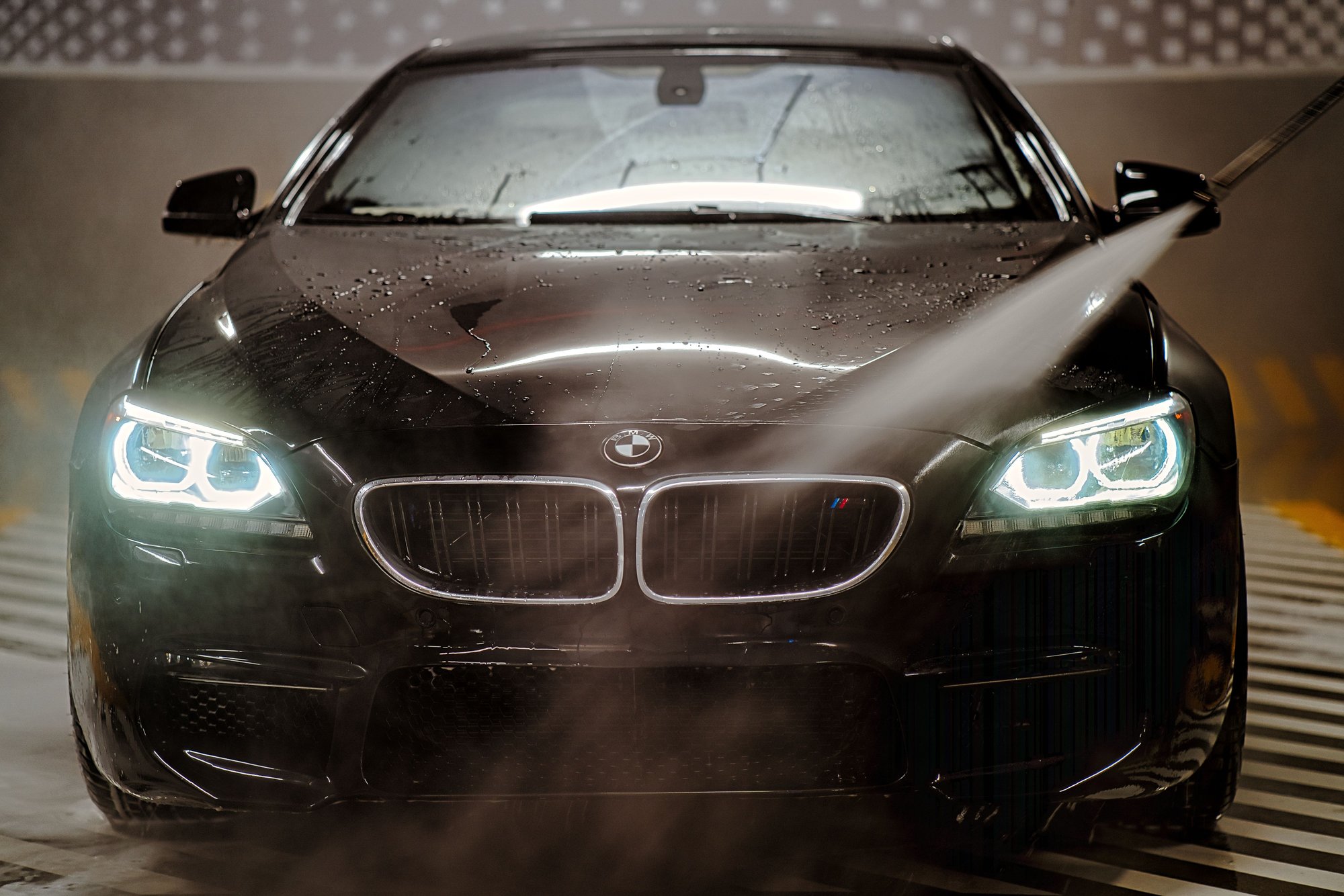 automatic carwash showering a vehicle clean