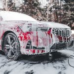 washing a car using self car wash equipment