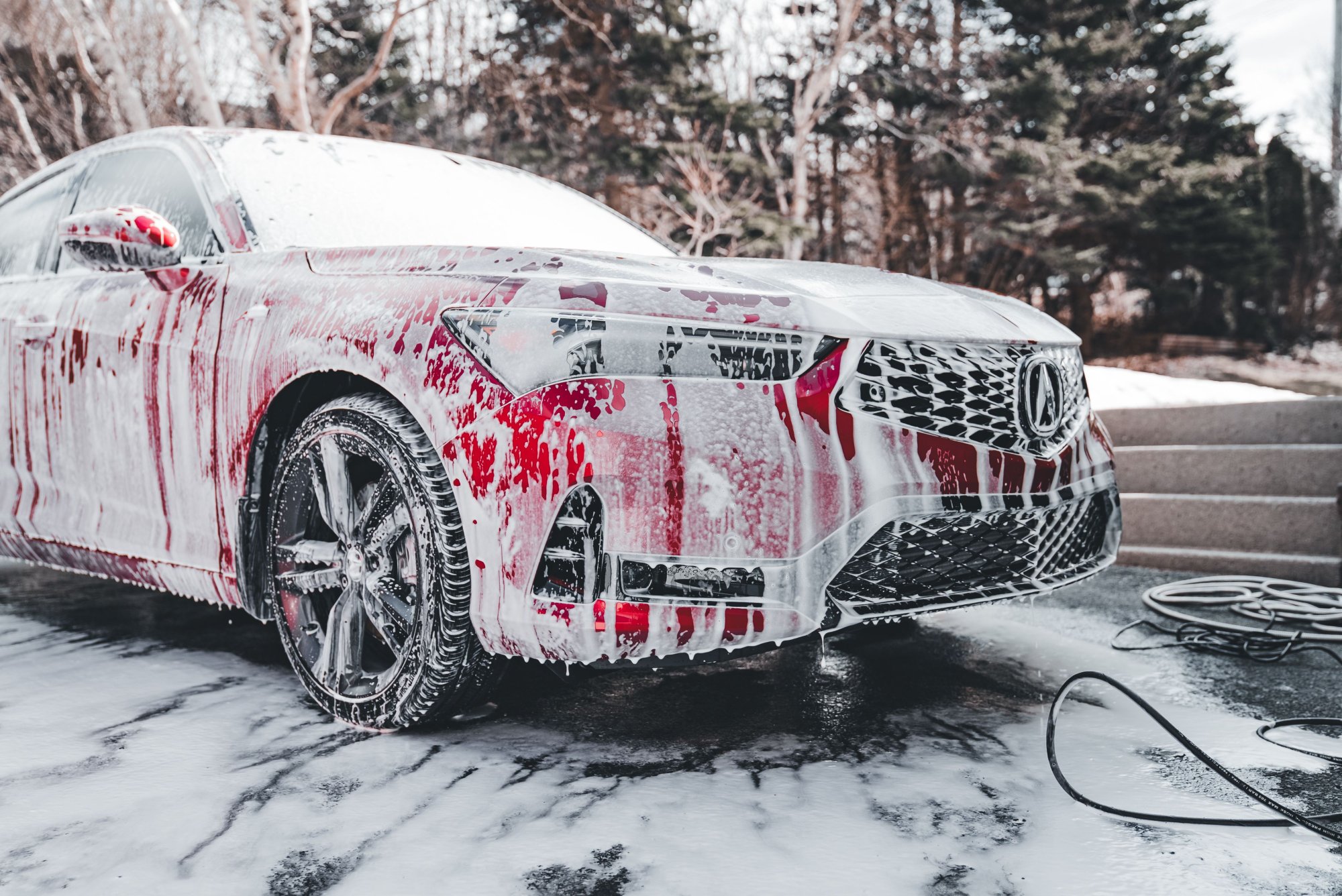 washing a car using self car wash equipment